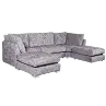 Gray sectional sofa with patterned cushions on a plain background