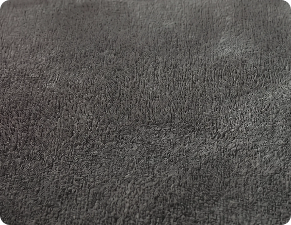 Close-up of a textured gray fabric surface