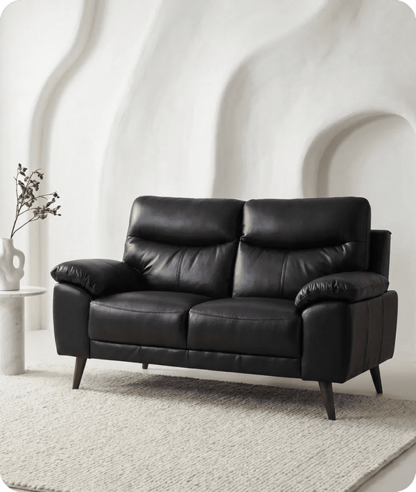ascot-black-leather-2-seater-sofa-in-a-uk-living-room