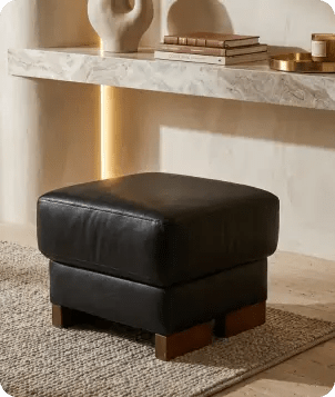 dalmore-black-leather-footstool-in-a-uk-living-room