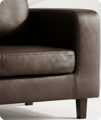 Brown leather armchair on a white background