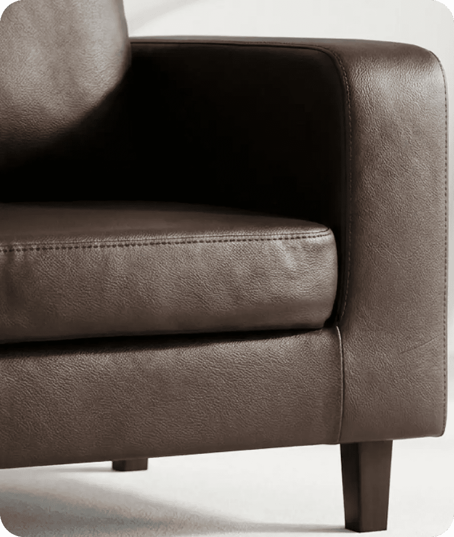 Brown leather armchair on a white background