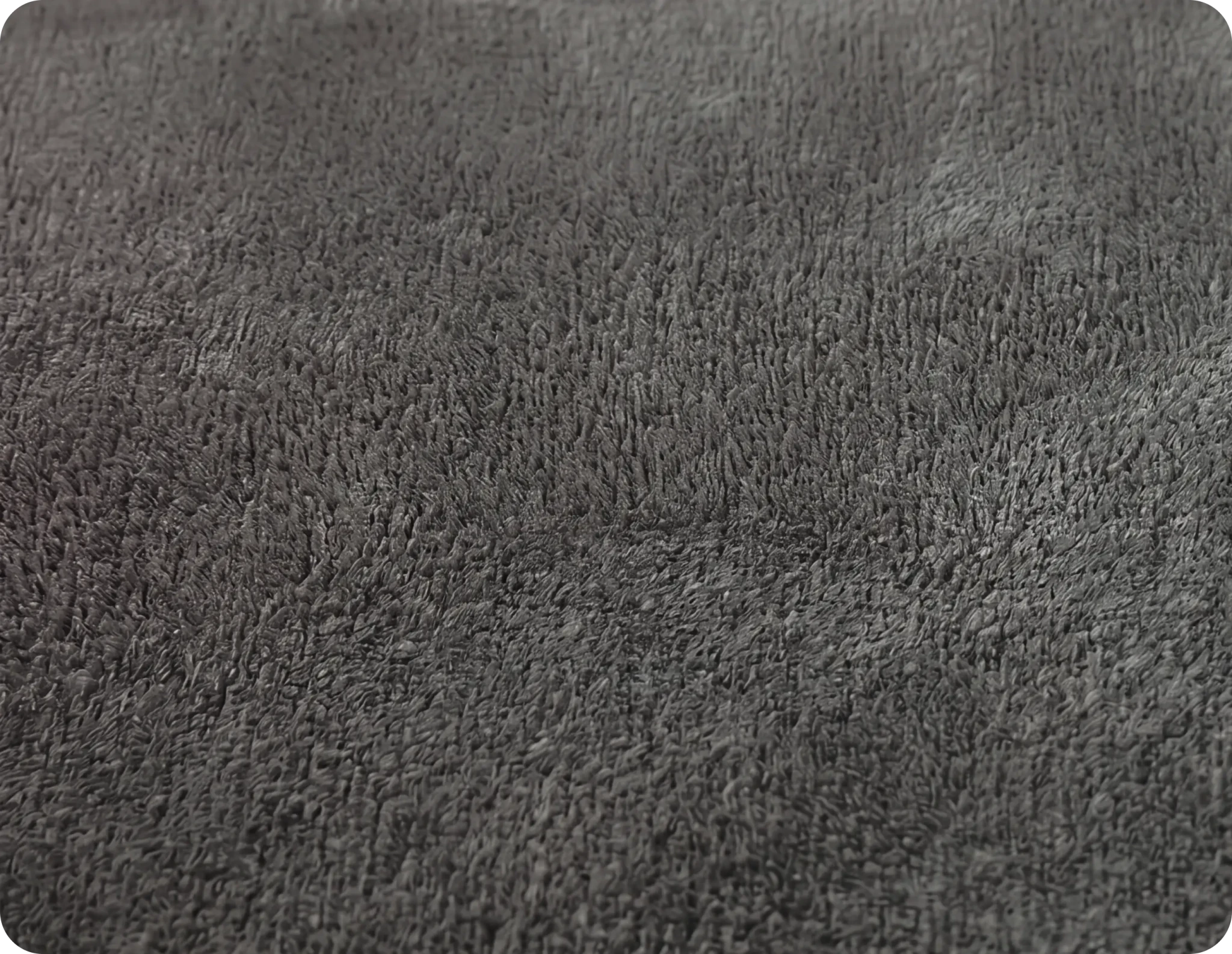 Close-up of a textured gray fabric surface