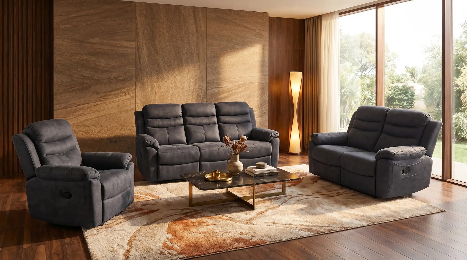 Gray recliner sofa set in a living room with wooden floor and large windows.