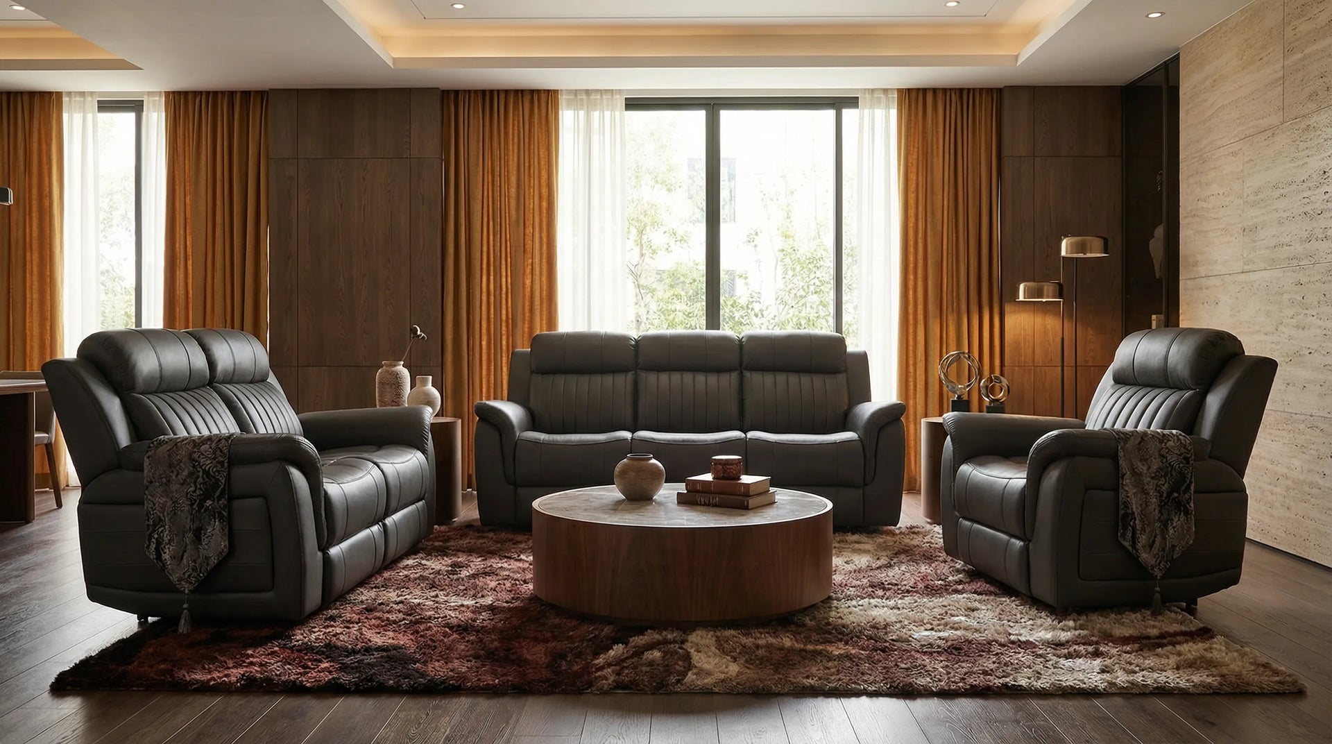 Modern living room with dark leather furniture and a wooden coffee table.