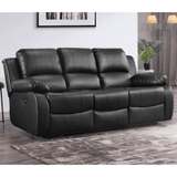 Black leather sofa in a living room setting with a rug and wall art.
